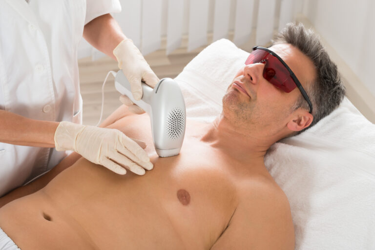 Beautician,Giving,Laser,Epilation,Treatment,To,Mature,Man,In,Clinic